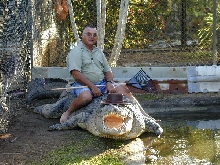 Guy sits on HUGE croc!!!!!!!!