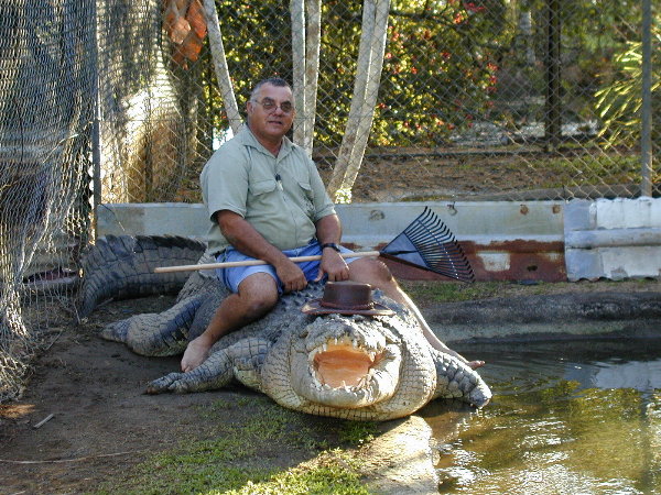 Guy sits on HUGE croc!!!!!!!!