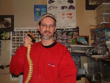 Me holding blk headed python @ 3 mos old
