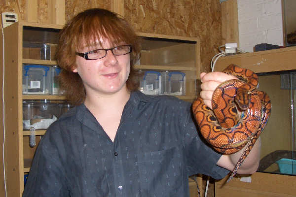 Holding Brazilian Rainbow Boa