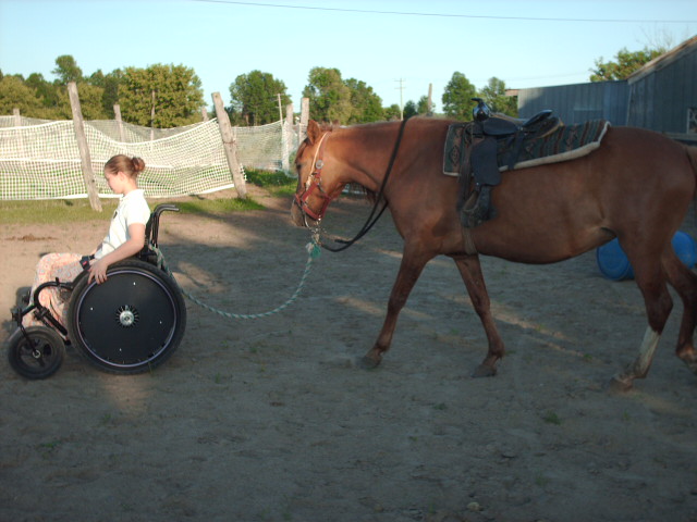 Meghan and Tierra with saddle on