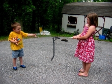 Kids with black  ratsnake