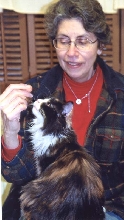 Bijou checks out what Mimi's been noshing on!