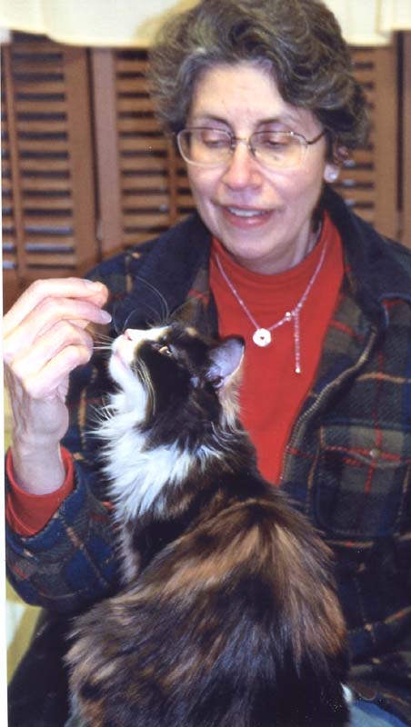 Bijou checks out what Mimi's been noshing on!
