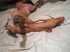 Lilly wiggles on the bed