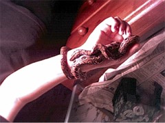 My male rainbow boa on my arm