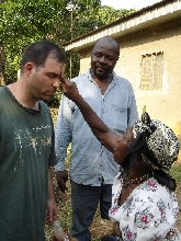 Paul Bodnar and Dr. Zachee Denis Bitjaa Kody receiving an African Tradition